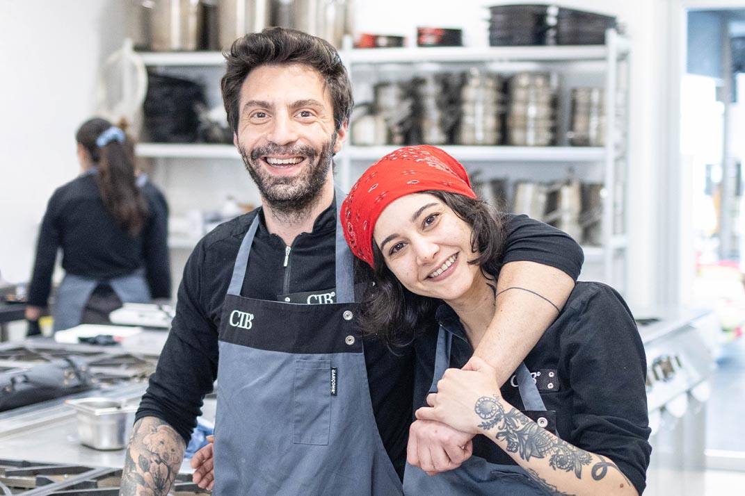 Professor teaching cooking to a student in a professional cooking course at the CIB